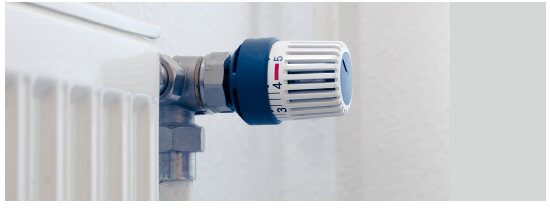 Thermostatic radiator valve on a white radiator